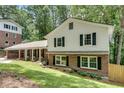 Lovely home with brick and siding, showcasing a well-kept lawn and inviting curb appeal at 2689 Cosmos Ne Dr, Atlanta, GA 30345