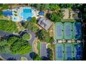 Aerial view showcases the community pool and tennis courts at 218 Oakmoor Ct, Lawrenceville, GA 30043