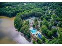 Aerial view of community amenities including pool, tennis courts, and lake access at 218 Oakmoor Ct, Lawrenceville, GA 30043