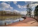 Beautiful wooden dock on a serene lake, perfect for fishing, boating, or enjoying the view at 218 Oakmoor Ct, Lawrenceville, GA 30043
