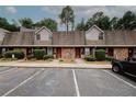 Townhome complex showcasing brick exteriors, well-manicured greenery, and convenient parking at 3101 Reeves Se St, Smyrna, GA 30080