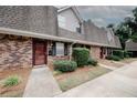 Brick townhome featuring tidy landscaping, a covered entrance, and neutral siding at 3101 Reeves Se St, Smyrna, GA 30080
