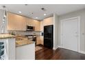 Efficient kitchen featuring granite countertops, stainless steel appliances, and hardwood floors at 905 Juniper Ne St # 701, Atlanta, GA 30309