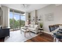 Cozy living room featuring large window, modern decor, and comfortable seating at 905 Juniper Ne St # 701, Atlanta, GA 30309