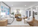 Bright and airy living room with stylish decor, hardwood floors, and large windows at 2070 Drew Valley Ne Rd, Brookhaven, GA 30319