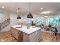 Modern kitchen with white countertops, a large island with a sink, and stainless steel appliances at 2164 James Aly, Atlanta, GA 30345
