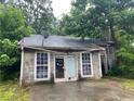 Close up of the front of a house with a stone facade and two entry doors at 5035 Chadwick Ct, Decatur, GA 30035