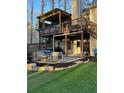 A split-level deck and patio is complete with outdoor seating, creating a relaxing outdoor living space at 5930 Shannon Drive Dr, Cumming, GA 30040