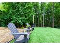 Backyard seating area featuring chairs and a table at 5930 Shannon Drive Dr, Cumming, GA 30040