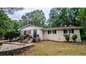 Inviting brick home featuring stone accents and a well-manicured front lawn at 1127 Renee Dr, Decatur, GA 30035