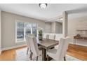 Dining room featuring a large window, hardwood floors, and seating for six at 17 Ivy Gates Ne, Atlanta, GA 30342