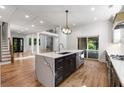 Stylish kitchen featuring a quartz island, stainless steel appliances, hardwood floors, and modern recessed lighting at 4201 Brookview Se Dr, Atlanta, GA 30339