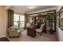 Dedicated office space filled with natural light, with built in book case and trim at 5268 Mulberry Pass Ct, Hoschton, GA 30548