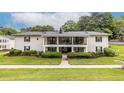 Attractive two-story apartment building with well-maintained landscaping and private balconies at 1150 Collier Nw Rd # G8, Atlanta, GA 30318