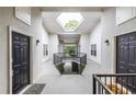 Well-lit hallway with skylight, doors to units, and staircase at 1150 Collier Nw Rd # G8, Atlanta, GA 30318