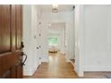 Inviting foyer with hardwood floors, neutral walls, and an open view to the living spaces beyond at 968 Dean Nw Dr, Atlanta, GA 30318