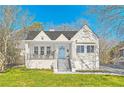 Beautiful home with a well-manicured lawn and inviting blue front door at 1337 M L King Jr Nw Dr, Atlanta, GA 30314