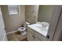 Cozy powder room features a vanity, mirror, and fixtures at 571 Cold Water Ln, Mcdonough, GA 30252