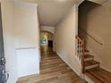 Inviting entry hallway showcasing wood floors and stairs leading to the upper level at 2131 Meadow Peak Rd, Duluth, GA 30097