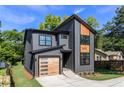 Contemporary-style home with a stylish exterior, showcasing a unique gray facade and an inviting entrance at 2608 Argo Drive Southeast Se Dr, Smyrna, GA 30080