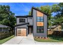Charming two-story home with modern architectural details, clean lines, and well-manicured landscaping at 2608 Argo Drive Southeast Se Dr, Smyrna, GA 30080
