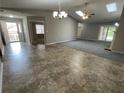 Large living room featuring beautiful flooring, natural light, and neutral paint scheme at 7123 Woodridge Ln, Union City, GA 30291