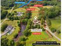 Expansive acreage view highlighting 3 parcels, Settingdown Creek, and lush greenery of the property at 4935 Stablegate Ct, Cumming, GA 30028