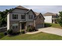 Charming two-story home with well-maintained lawn, brick details, and a two-car garage at 108 Fountain Oak, Villa Rica, GA 30180