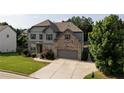 Stunning two-story home with landscaped yard, gray siding, brick accents, and a two-car garage at 108 Fountain Oak, Villa Rica, GA 30180