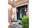 Inviting front entrance with decorative lanterns and charming dog statues at 6340 Koweta Rd, Fairburn, GA 30213