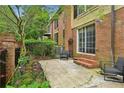 Inviting backyard patio with brick accents and cozy seating area at 1634 Ponce De Leon Ne Ave # 514, Atlanta, GA 30307