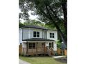 Inviting two-story home with a charming porch and beautifully landscaped front yard at 1962 Compton Se Dr, Atlanta, GA 30315