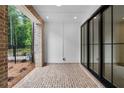 Private brick patio with sliding glass doors, perfect for outdoor seating and entertaining at 334 Olmstead Way # 37, Alpharetta, GA 30022