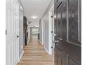 Inviting entrance hall with hardwood floors and a modern color scheme at 2183 Miranda Dr, Morrow, GA 30260