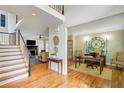 Spacious foyer featuring hardwood floors, an adjacent living room, and home office space at 4075 Hickory Fairway Dr, Woodstock, GA 30188