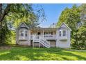 Charming home showcasing a quaint front porch and beautiful bay windows at 6797 Braswell Mountain Rd, Rockmart, GA 30153