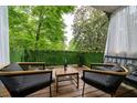 Cozy outdoor patio with comfortable seating, wooden deck and pleasant view at 2805 Ne Expressway Ne # B 16, Atlanta, GA 30345