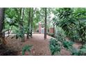 Charming brick home nestled among mature trees, offering a serene and private setting at 5190 Southlake Dr, Alpharetta, GA 30005