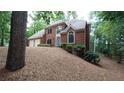 Beautiful two-story brick home with a well-maintained lawn and a two-car garage at 5190 Southlake Dr, Alpharetta, GA 30005