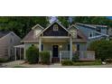 Charming home featuring a well-manicured lawn, inviting front porch, and classic architectural details at 176 Rockyford Ne Rd, Atlanta, GA 30317