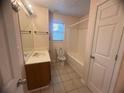 Well-lit bathroom with a tub, shower, and vanity, providing essential comfort and convenience at 2295 Eagle Pointe Ct, Lawrenceville, GA 30044