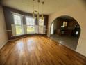 Bright dining room featuring hardwood floors and a bay window overlooking the yard at 2295 Eagle Pointe Ct, Lawrenceville, GA 30044