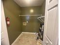Spacious laundry room includes shelving for storage at 2295 Eagle Pointe Ct, Lawrenceville, GA 30044