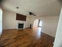Cozy living room with hardwood floors and a fireplace, perfect for relaxing at 2295 Eagle Pointe Ct, Lawrenceville, GA 30044