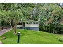 View of the home's facade, featuring a verdant lawn and a mailbox at 629 Hickory Se Trl, Mableton, GA 30126