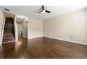 Bright living room boasting gleaming hardwood floors and a modern ceiling fan at 1343 Penhurst Dr, Lawrenceville, GA 30043