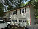 Two-story home with a garage and a quaint, inviting facade at 135 Woodcrest Dr, Covington, GA 30016