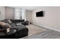 Inviting living room features a cozy sectional sofa, soft rug, and modern decor elements at 1421 Peachtree Ne St # 401, Atlanta, GA 30309