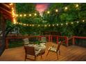Inviting back deck with overhead string lights and comfortable seating for outdoor relaxation at 1734 8Th St, Brookhaven, GA 30341