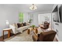 Bright living room with hardwood floors, stylish furniture, and lots of natural light at 1734 8Th St, Brookhaven, GA 30341